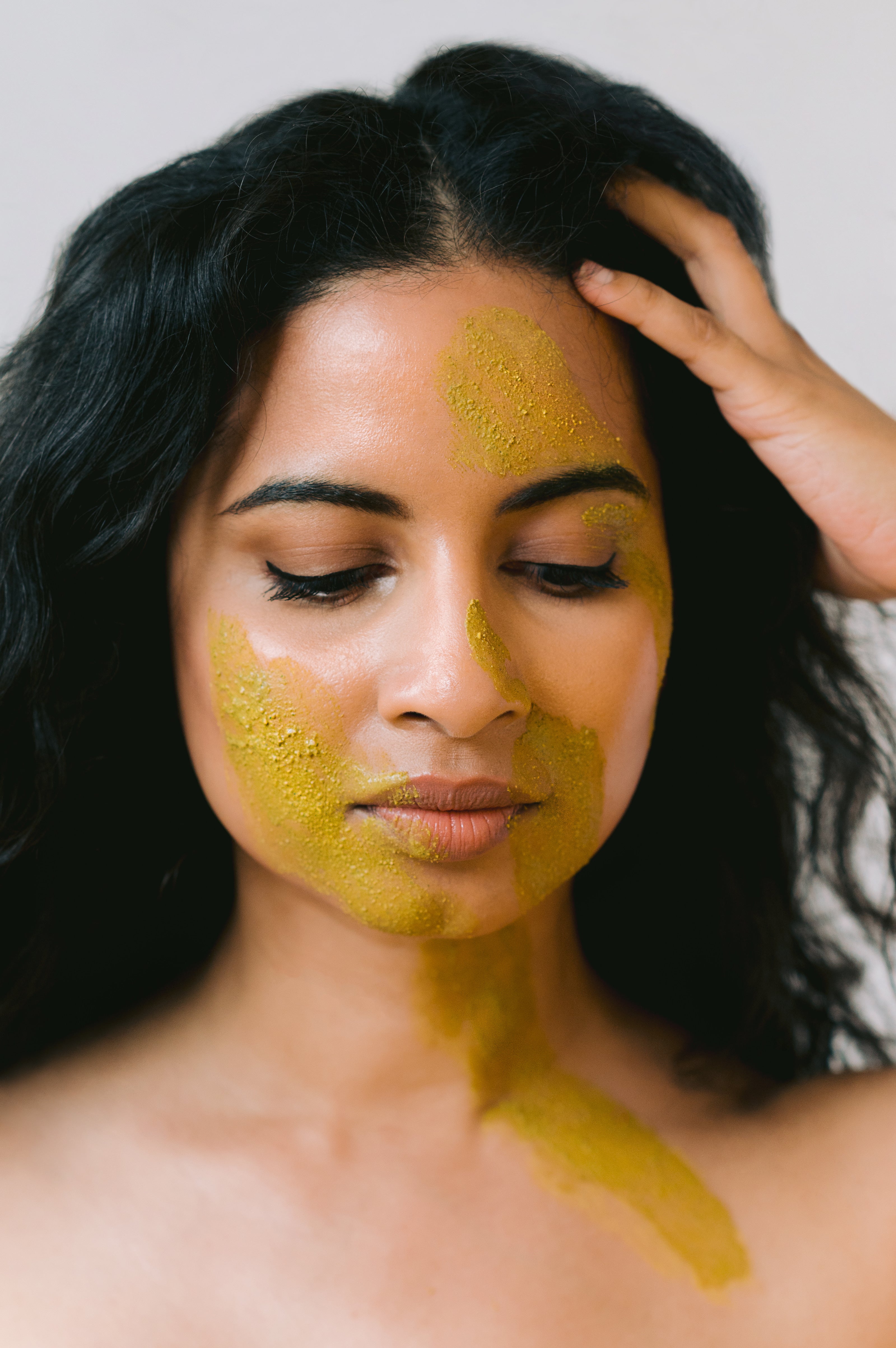 Model showcasing glow getter face mask. Refresh dull, dehydrated skin with this glow-inducing facial powered by skin transformative plant extracts. This unique powder formula delivers deep hydration - feeding your skin with powerful antioxidants, minerals, and phytonutrients for enhanced radiance. Instantly comfort delicate complexions and revitalize fatigued skin.