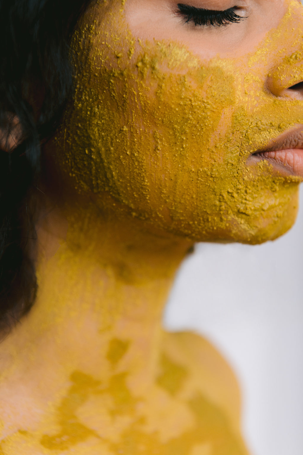 Model showcasing her skin with the glow up face mask. This iconic face mask duo actively cleanses, nourishes, combats blemishes and strengthens skin to reveal a radiant supple complexion.